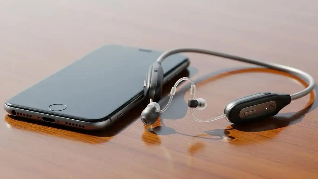 1 ear neckband hearing aid with Bluetooth and neckband design on a table